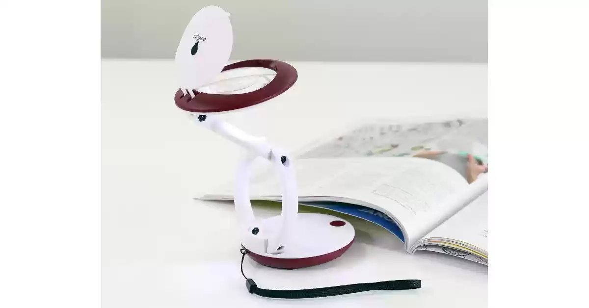 Lupa de de bolso articulada de 5,5 cm de diâmetro de cor branca e magenta, correia de pulso preta