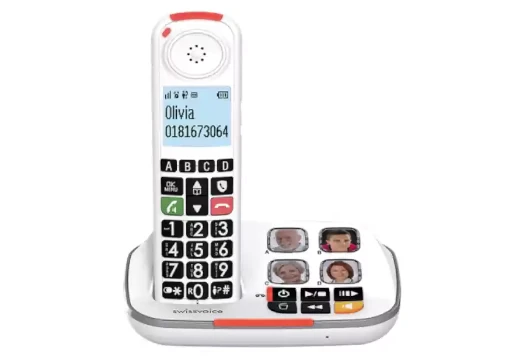 Telefone sem fios branco com teclas pretas grandes e teclas de marcação rápida fotografia na base